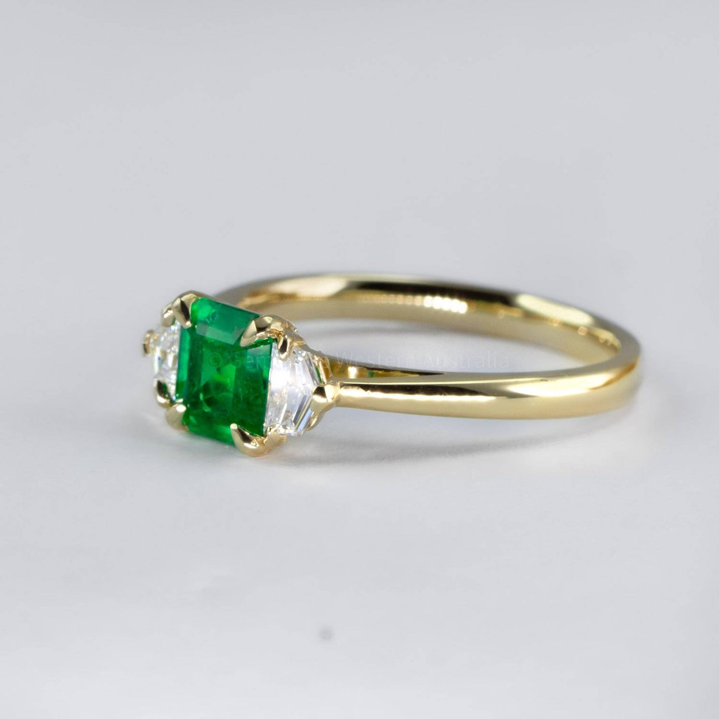 Emerald Cut Emerald and Cadillac Diamonds Three Stone Ring