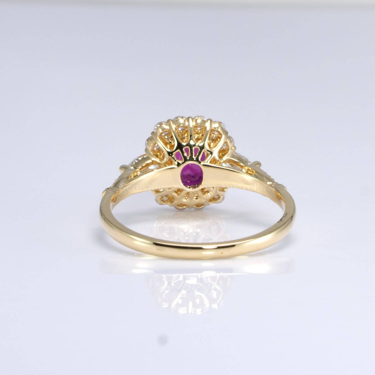 Natural Ruby Ring with Pear-Shaped Diamonds and Halo of Round Diamonds in 18K Yellow Gold | Natural Gemstone Jewellery