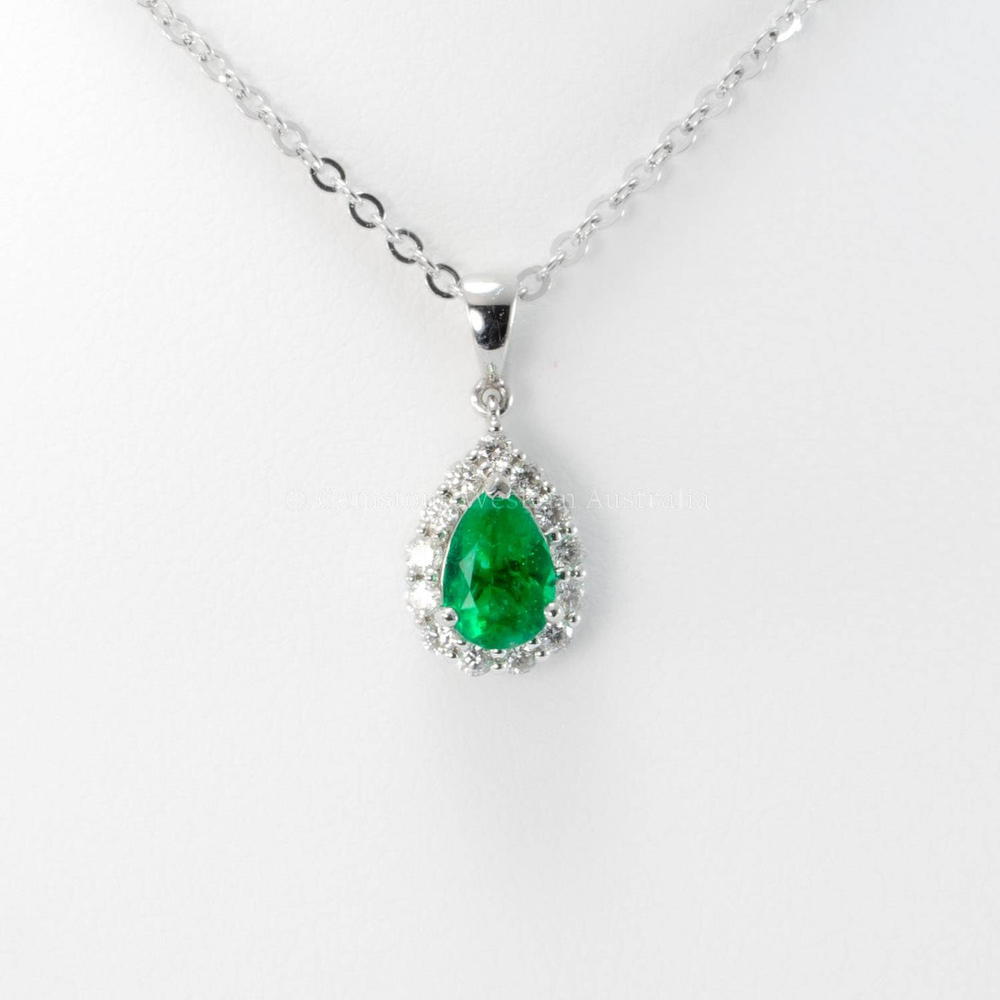 Natural Colombian Emerald and Diamond Halo Pendant in Platinum