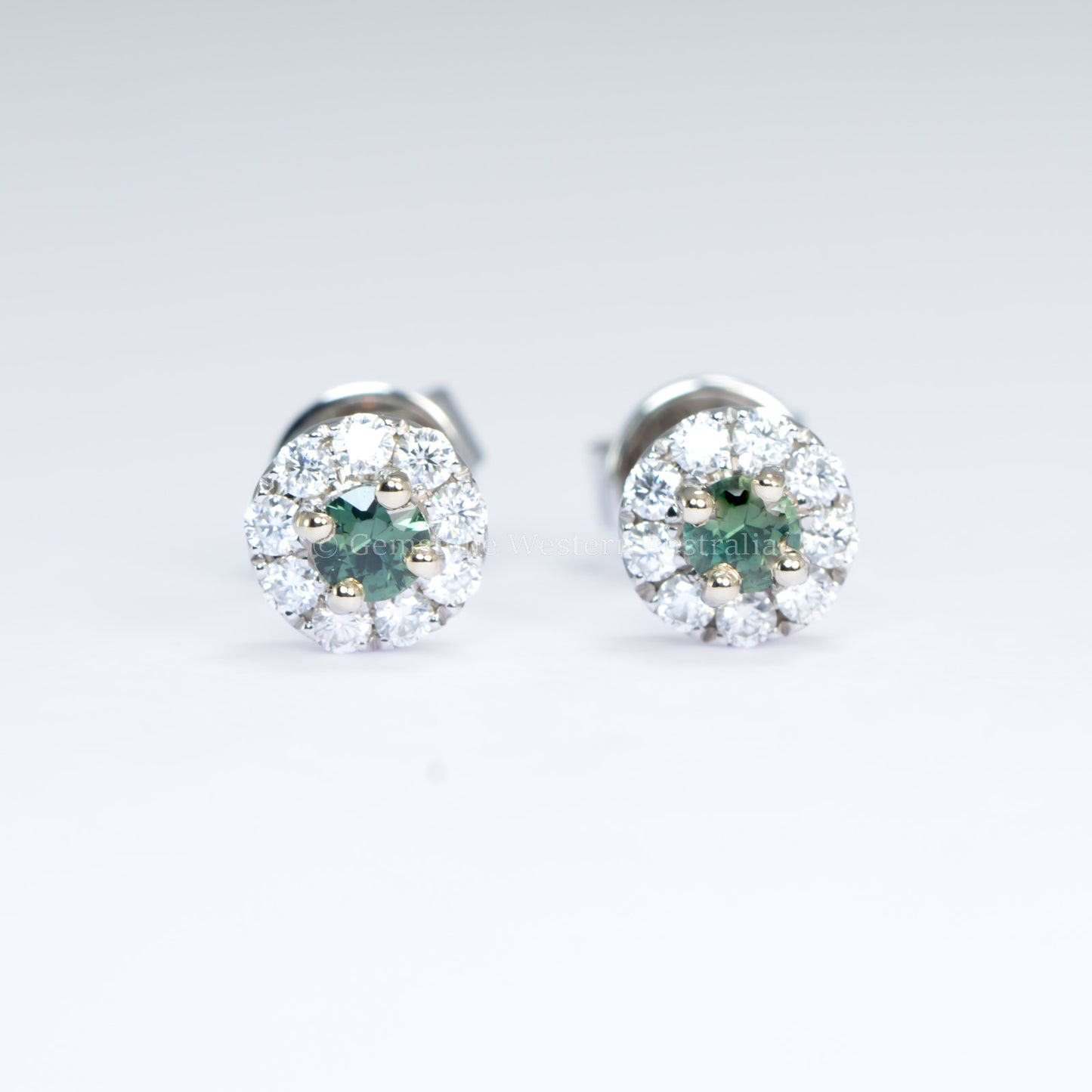 Natural Teal Sapphire Stud Earrings in 9K White Gold with Moissanite Halo