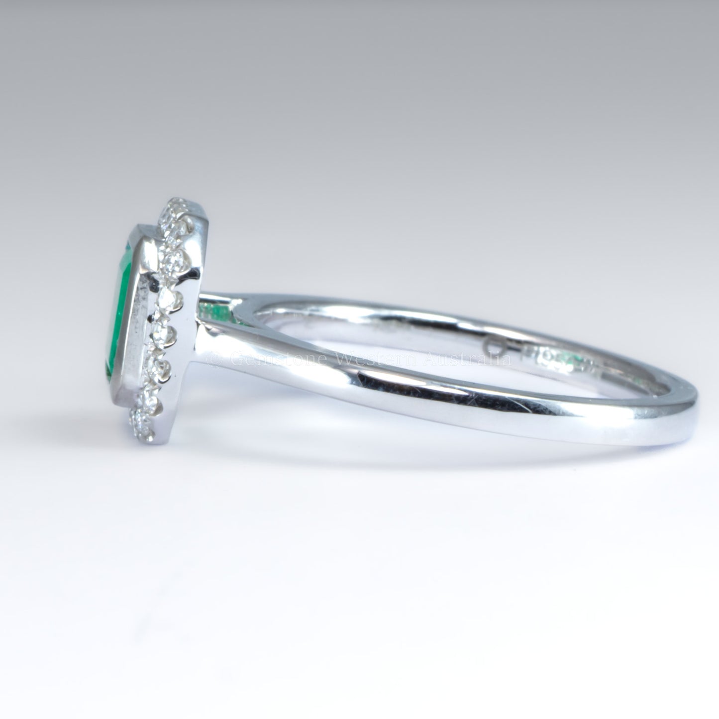 Emerald Cut Colombian Emerald Ring with Diamond Halo in Platinum