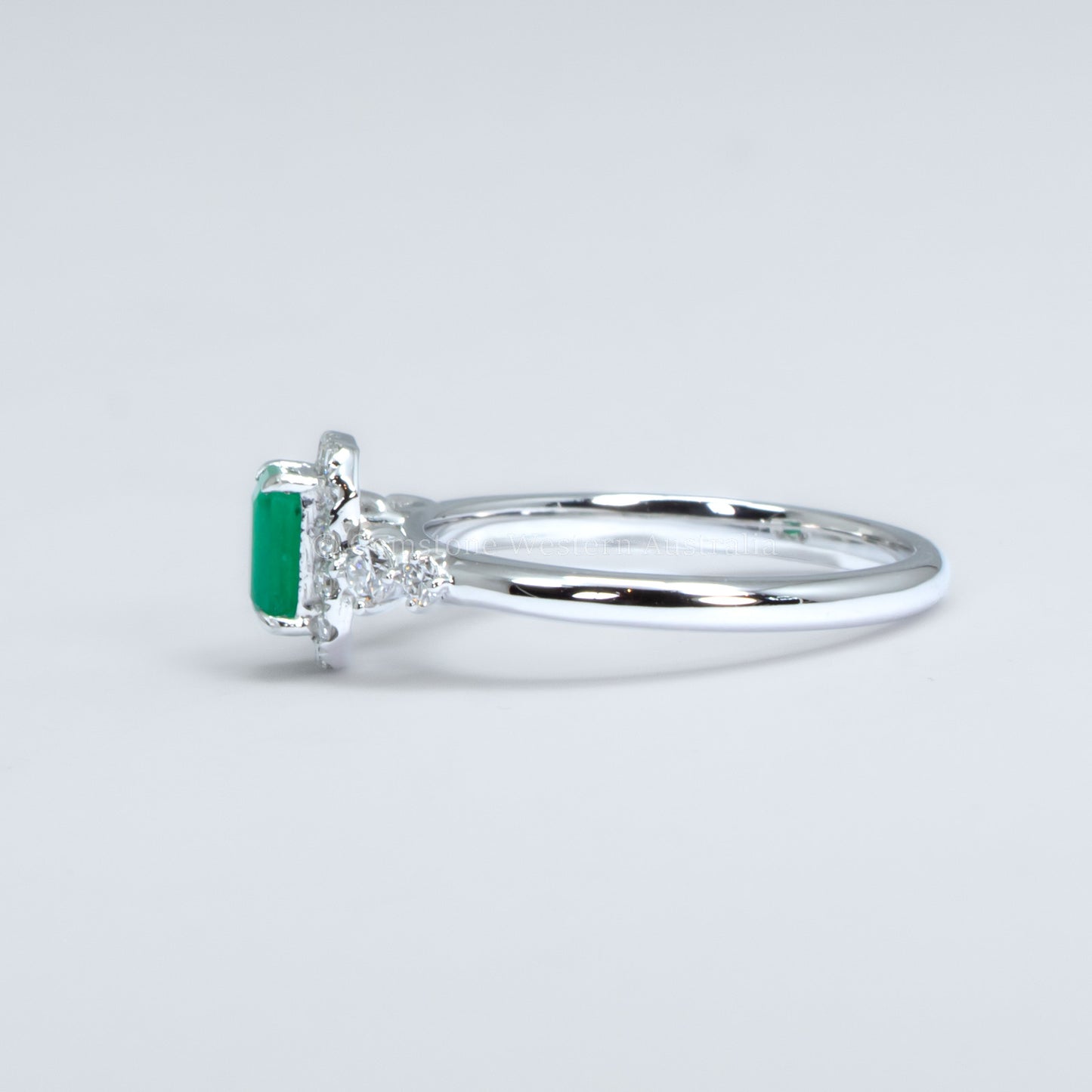 Colombian Emerald Halo Ring in Platinum with Compass-Set Diamonds