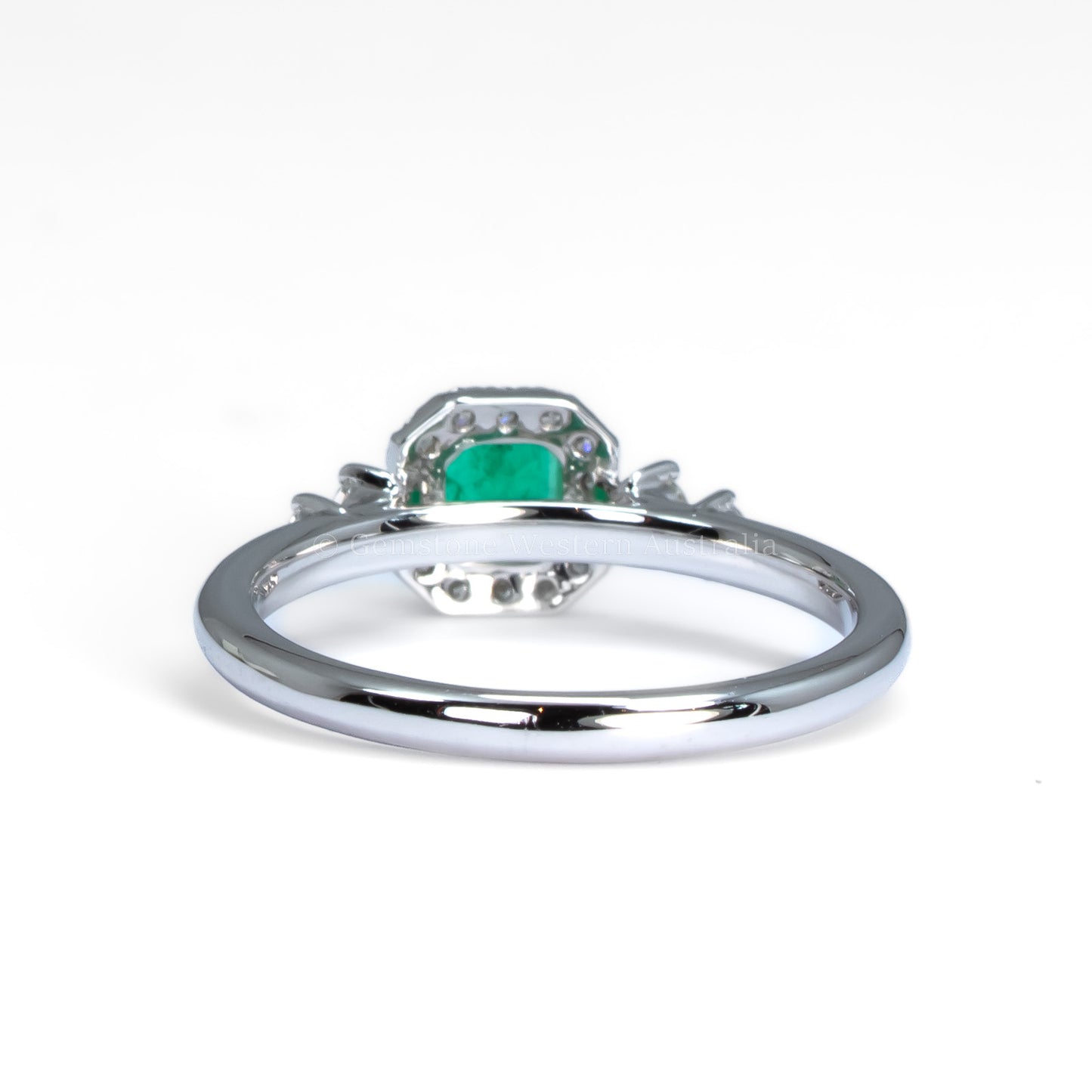 Platinum Ring with Emerald Cut Colombian Emerald and Diamond Halo