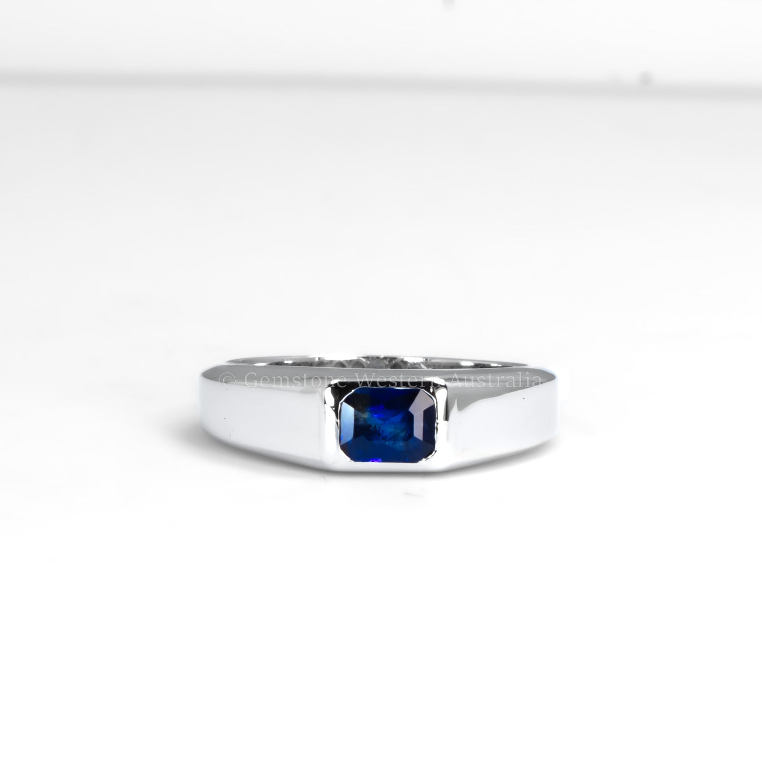 Platinum Men’s Ring with Bezel-Set Blue Sapphire