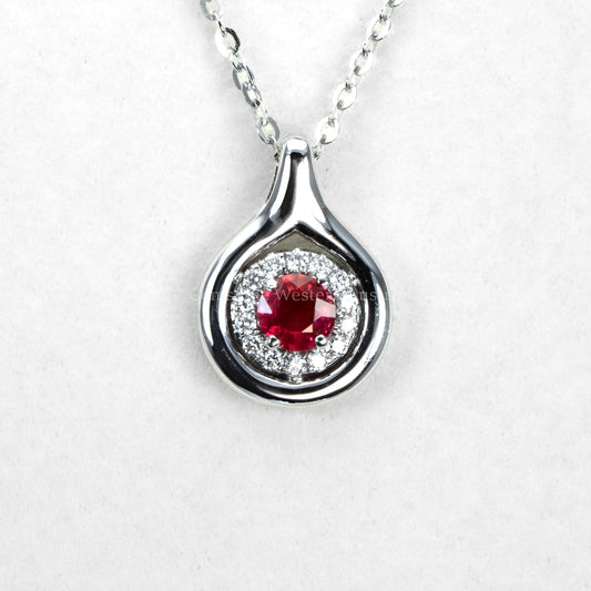 Round Ruby and Diamond Halo Pendant in White Gold