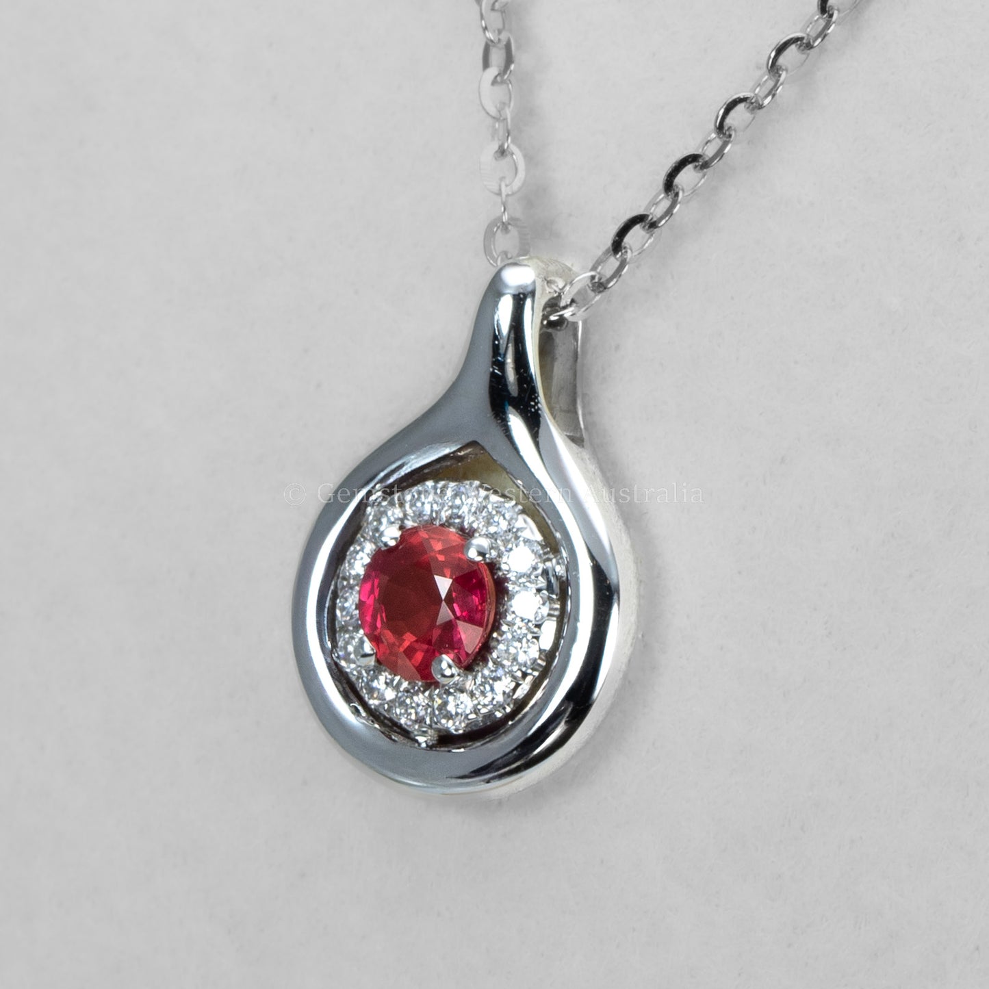 Round Ruby and Diamond Halo Pendant in White Gold
