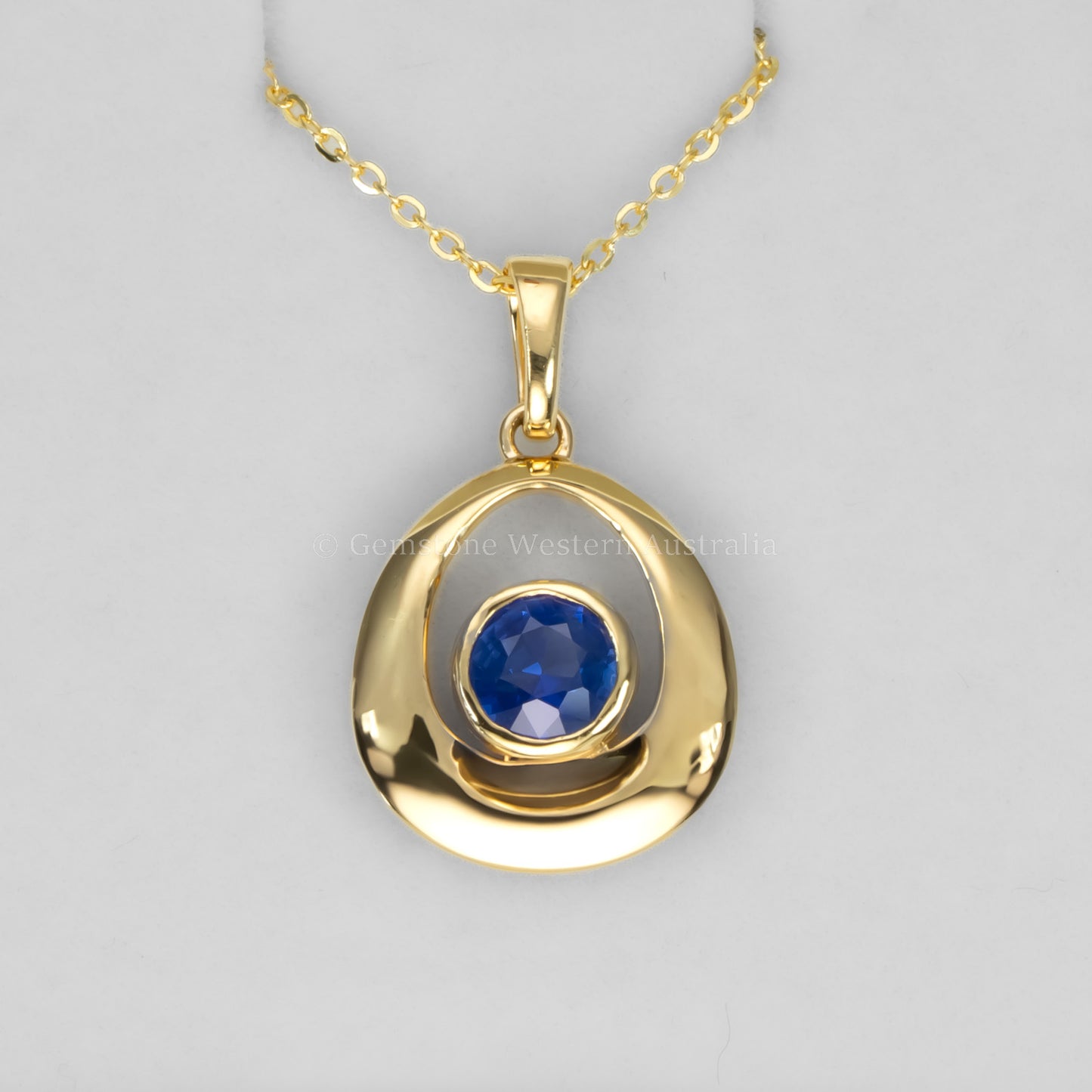 Blue Sapphire Pendant in 18K Yellow Gold – Contemporary Teardrop Design