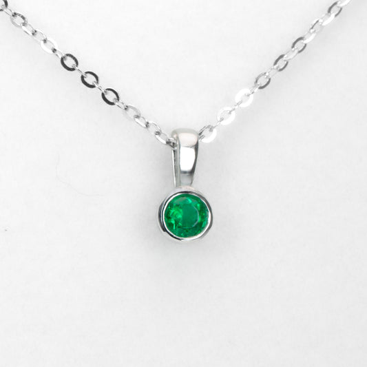 Round Emerald Solitaire Pendant in Platinum with Vivid Green 0.18ct Stone