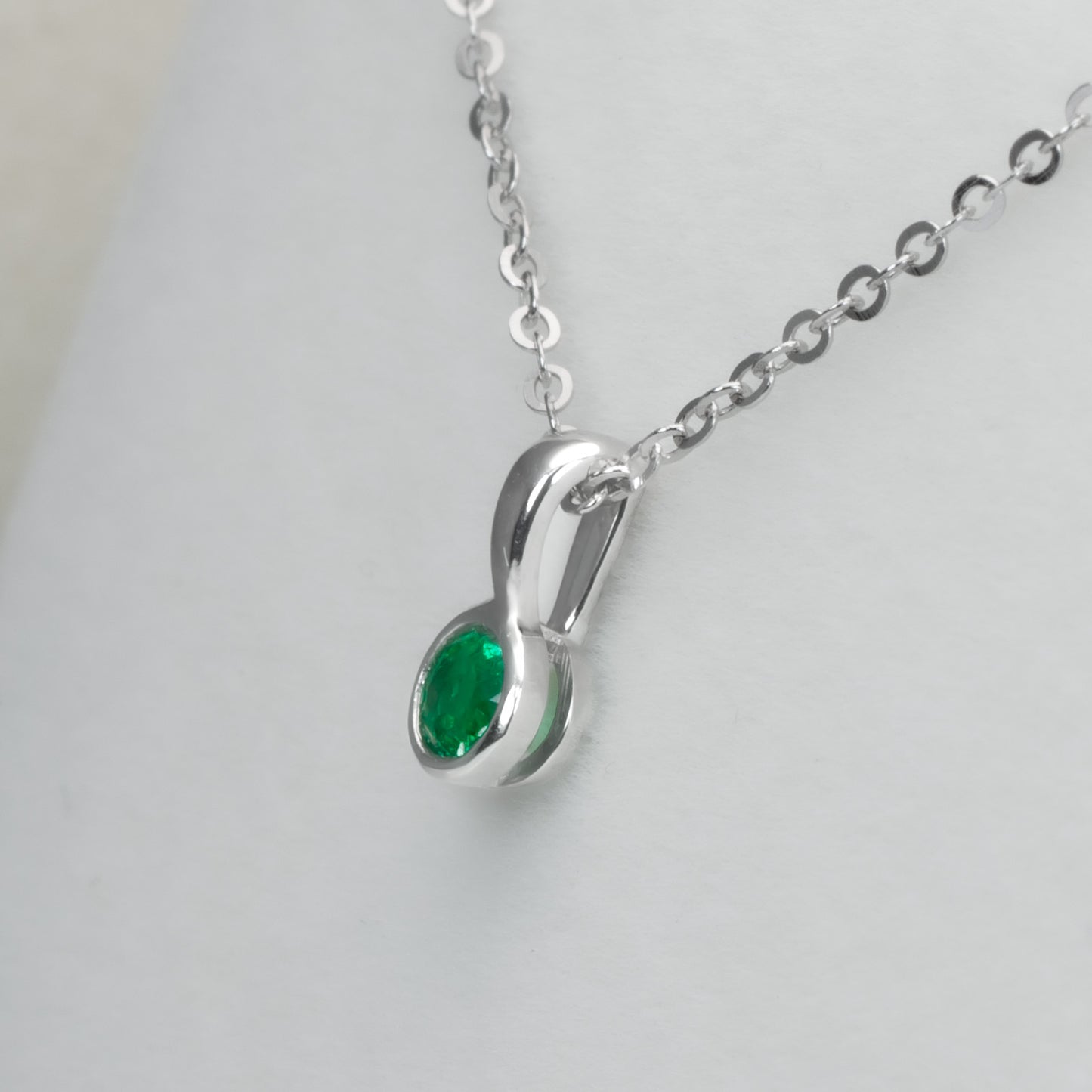 Round Emerald Solitaire Pendant in Platinum with Vivid Green 0.18ct Stone