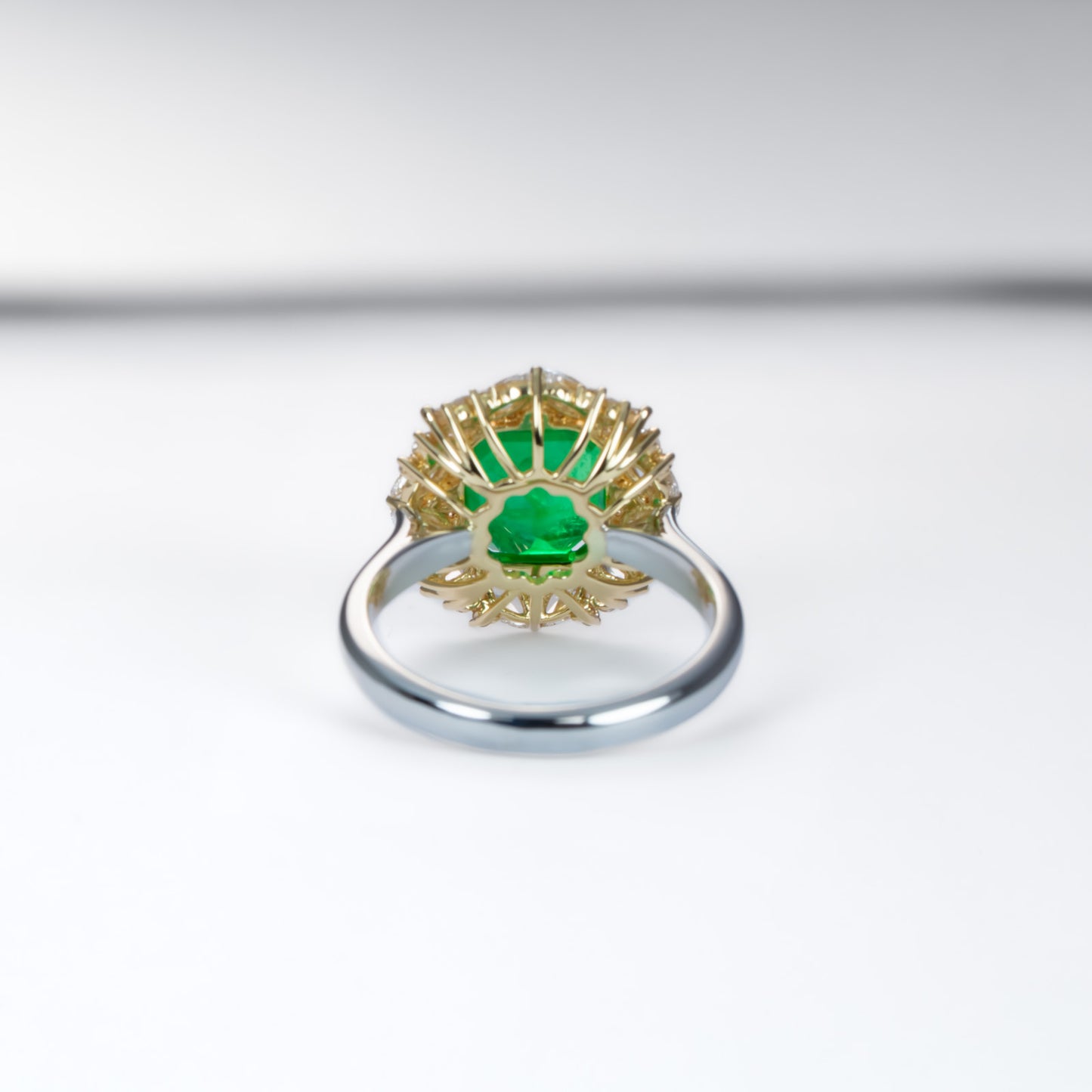 Emerald Statement Ring with Diamond Halo in 18K Gold and Platinum