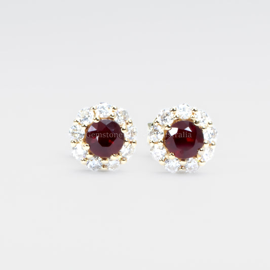 front view of ruby studs in grey background