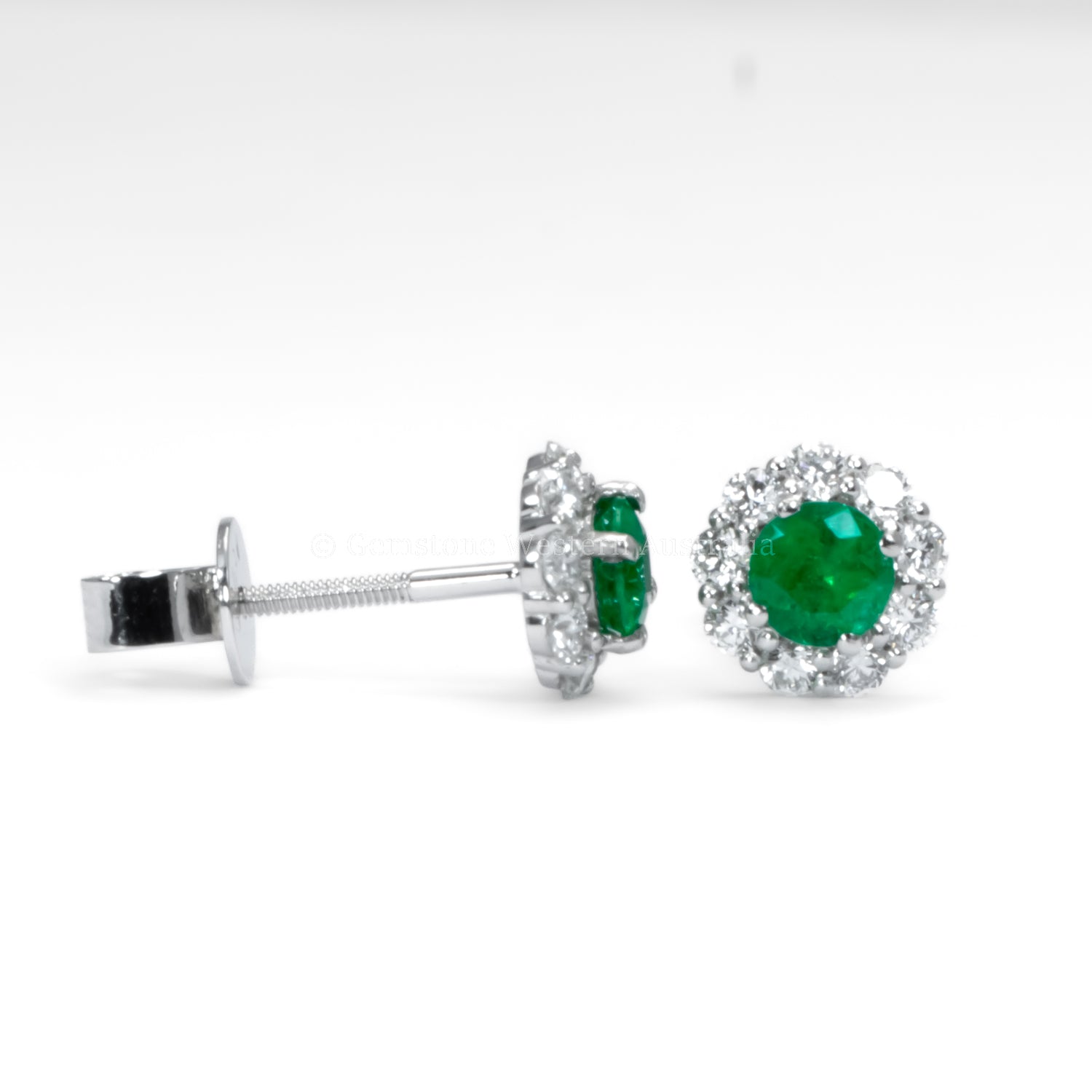 contrast of side and front view of Colombian Emerald earrings in white background
