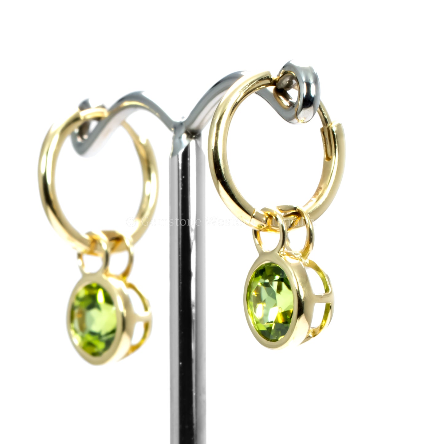 side view of peridot earrings in yellow gold