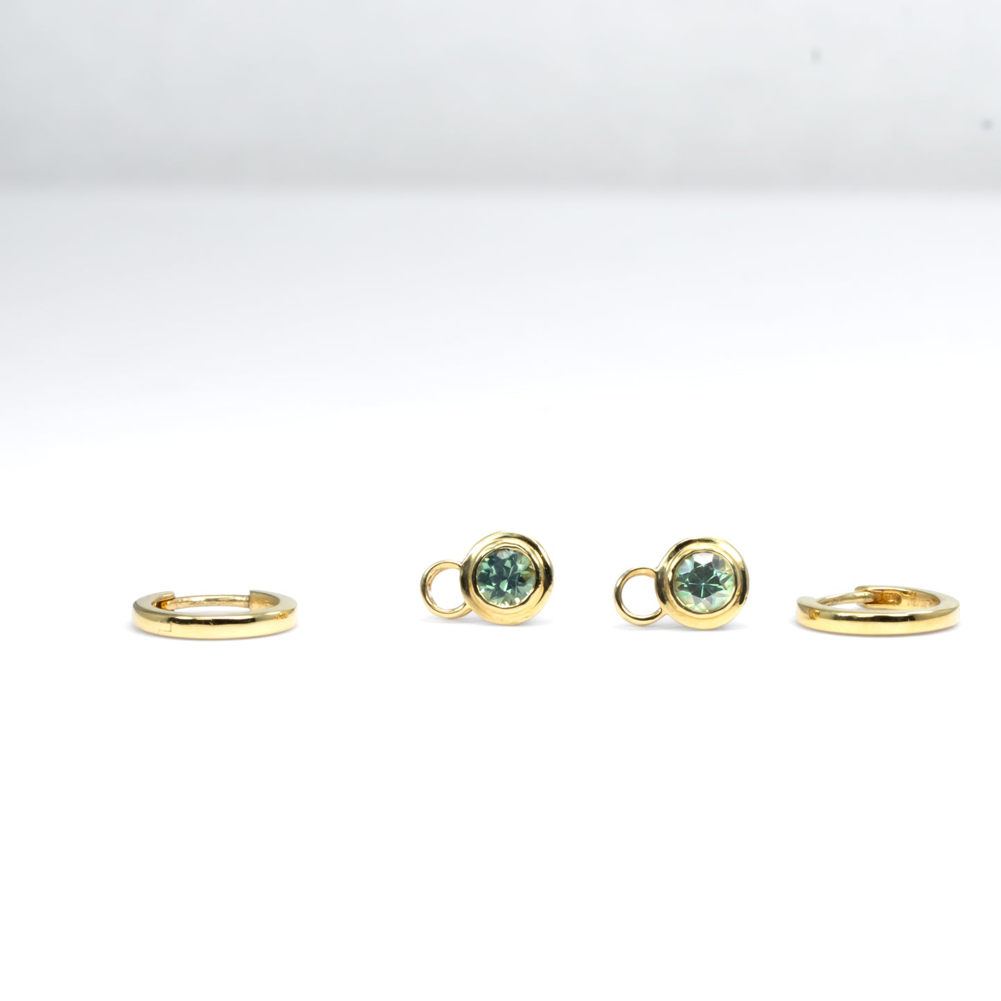 view of Australian sapphire charms and gold hoop earrings in 18K gold 