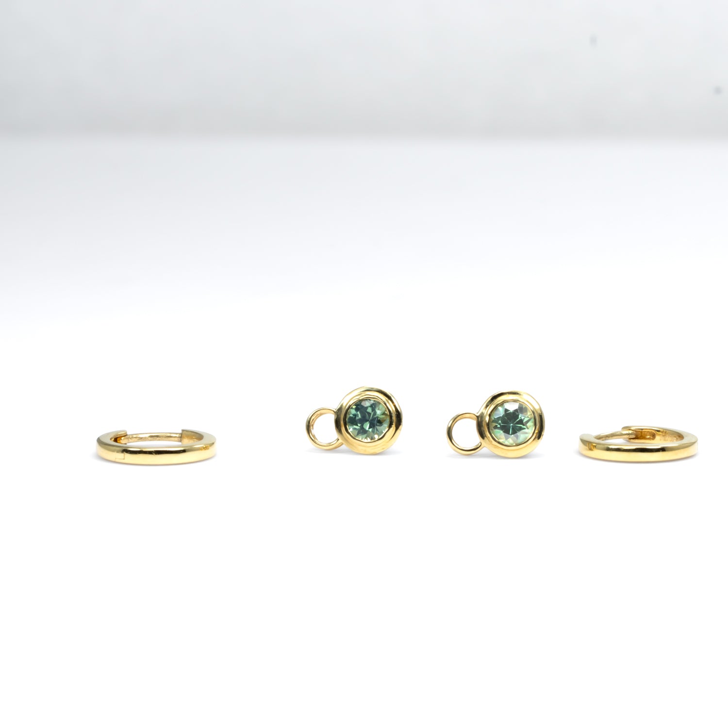 view of Australian sapphire charms and gold hoop earrings in 18K gold 