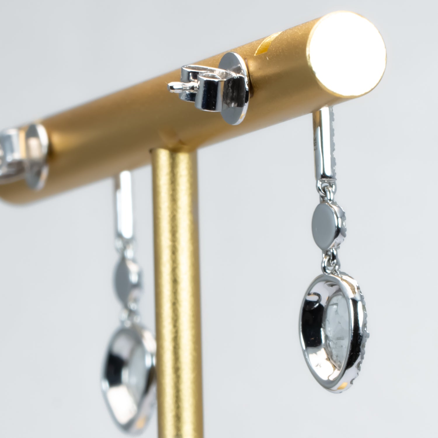 back view of salt and pepper diamond slice earrings on white background