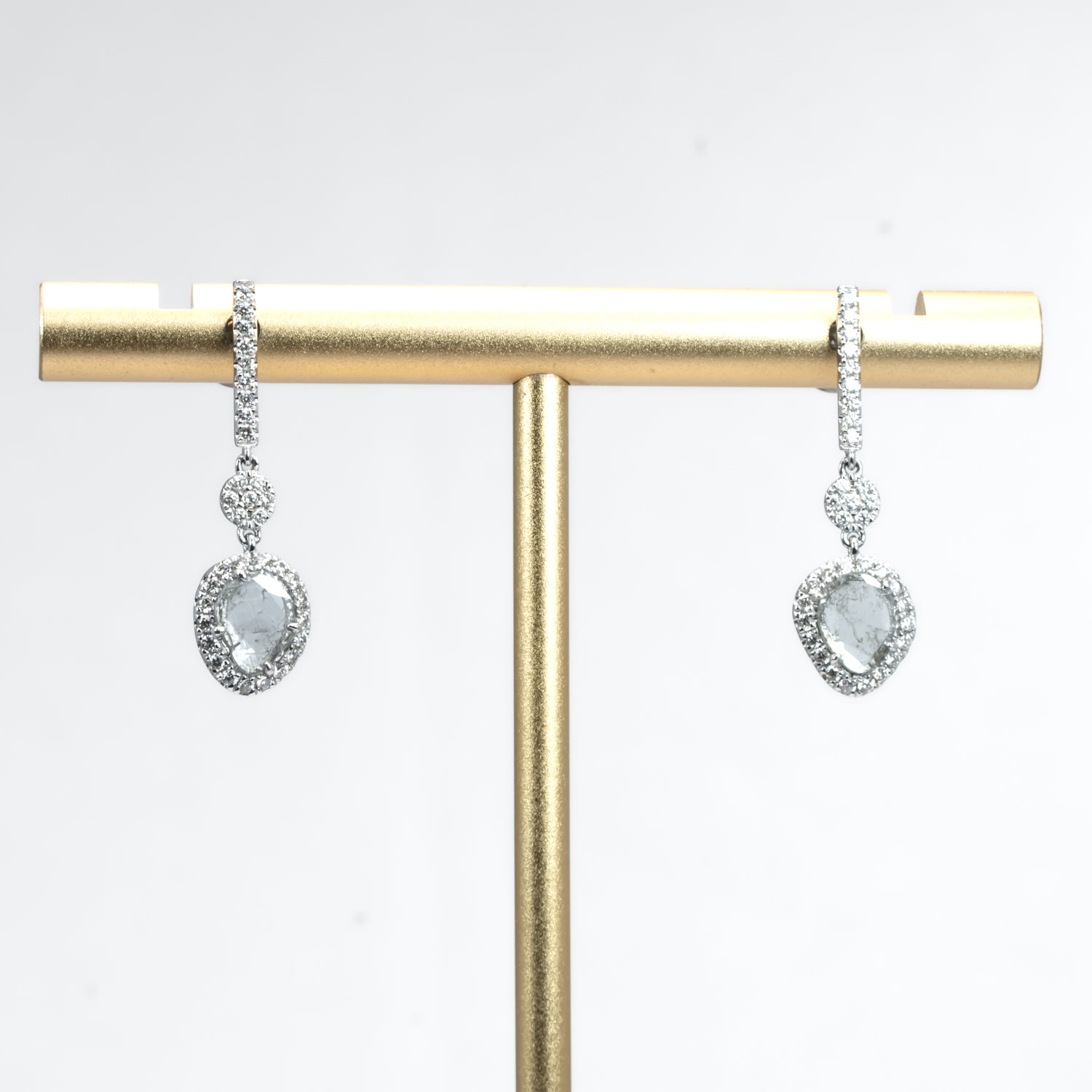 salt and pepper diamond slice earrings on white background