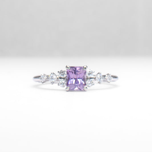 Platinum pink sapphire ring with natural diamonds in gray background