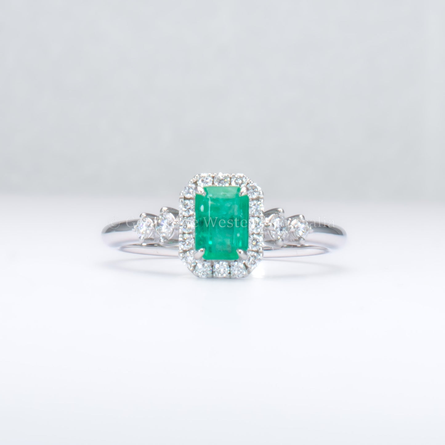 Natural Colombian Emerald and Diamond Halo Platinum Ring