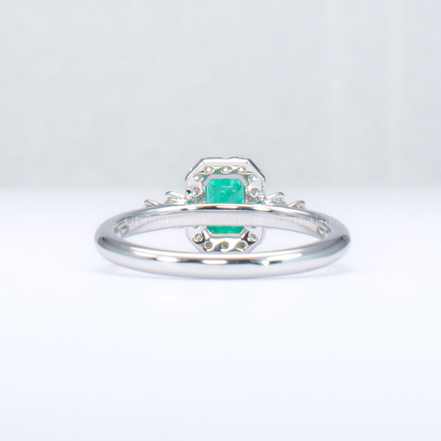 Natural Colombian Emerald and Diamond Halo Platinum Ring