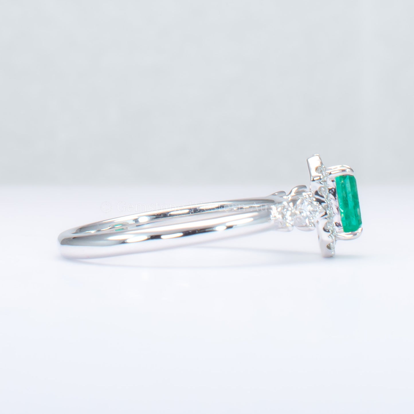 Natural Colombian Emerald and Diamond Halo Platinum Ring