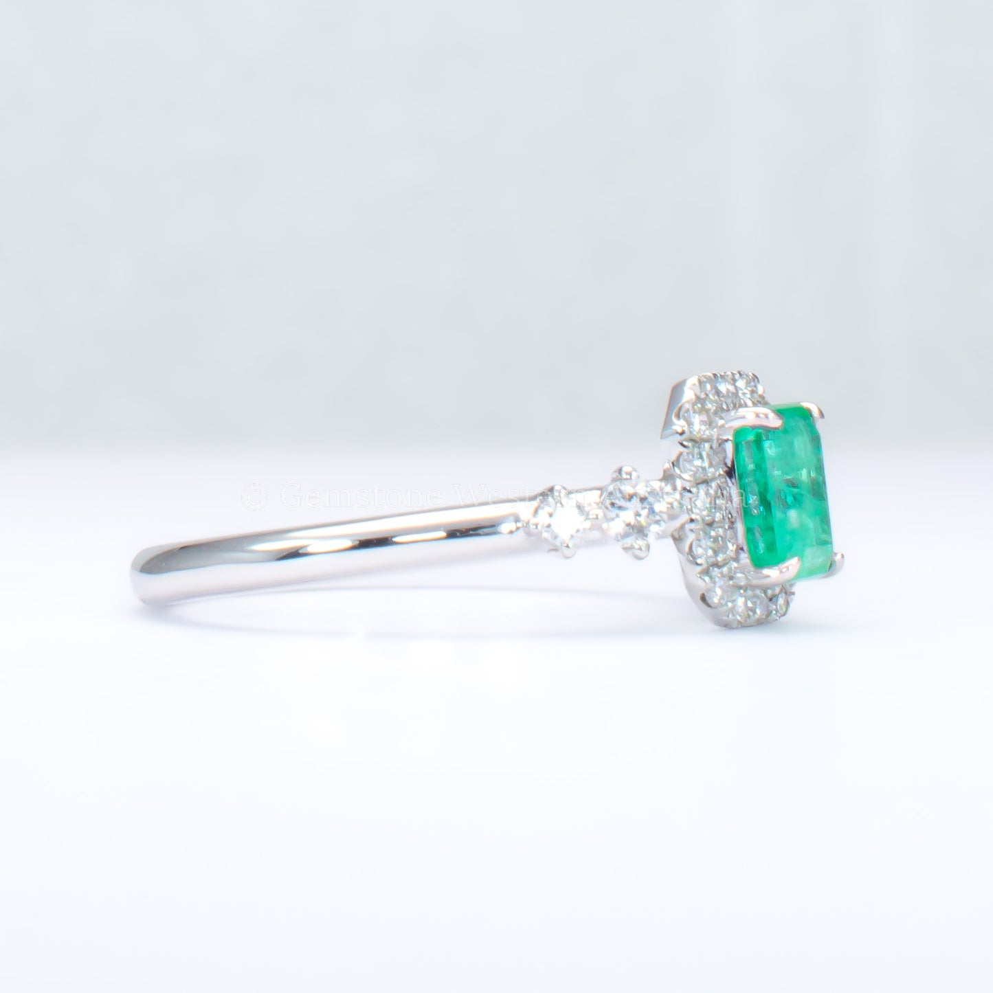 Natural Colombian Emerald and Diamond Halo Platinum Ring