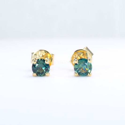 Australian teal blue sapphire gold stud earrings in gray background