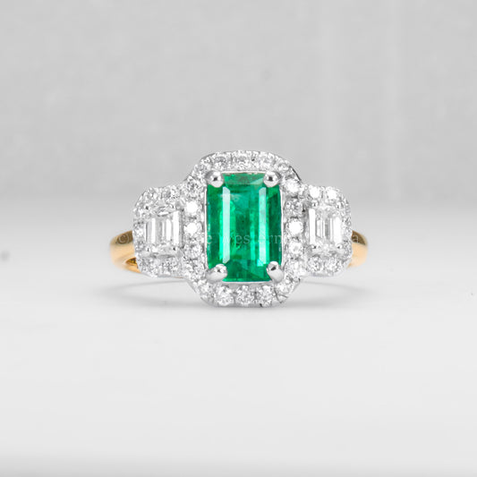 Elongated Colombian Emerald Three-Stone Halo Ring in Platinum and Gold