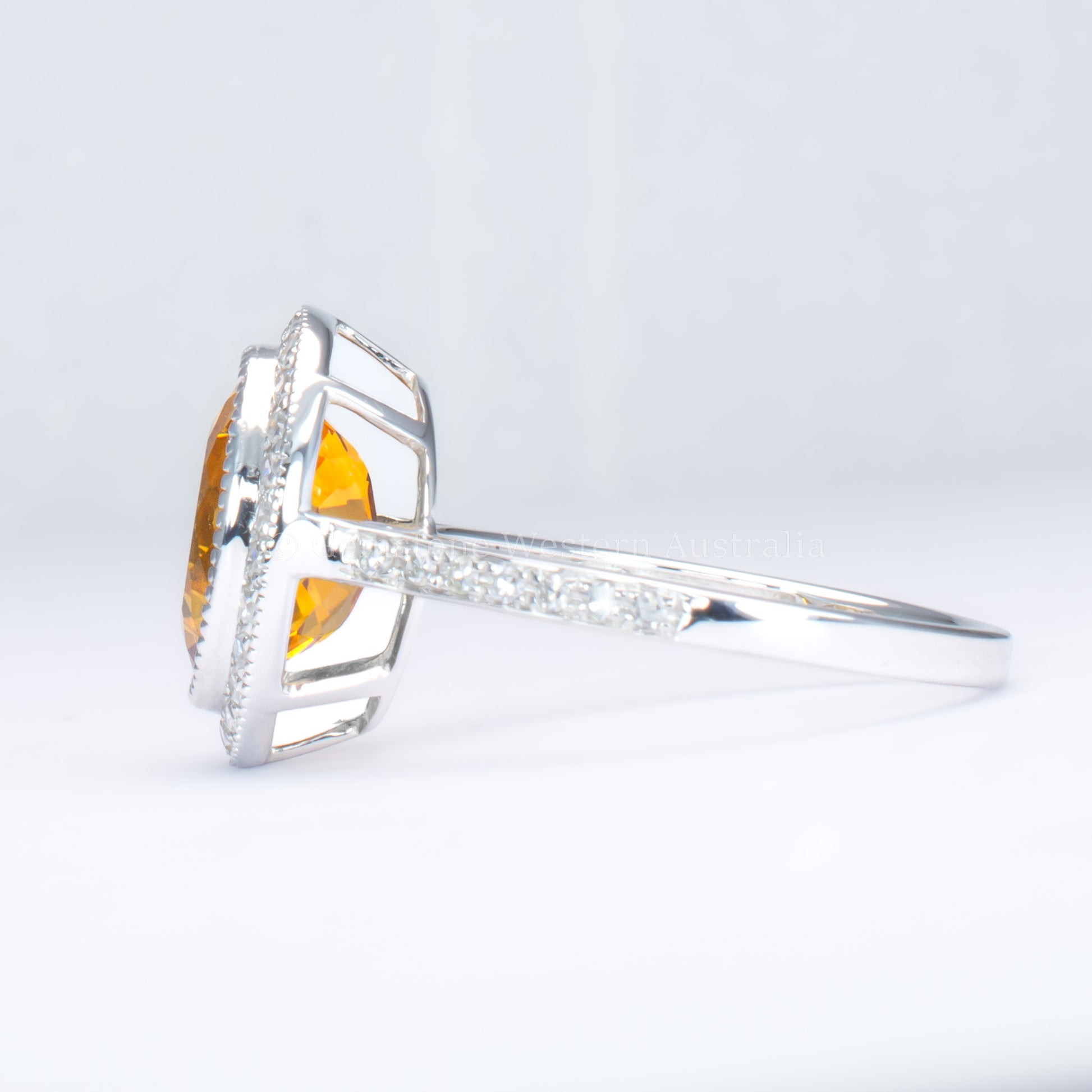 Oval-Cut Citrine Ring with Diamond Halo in 18K White Gold