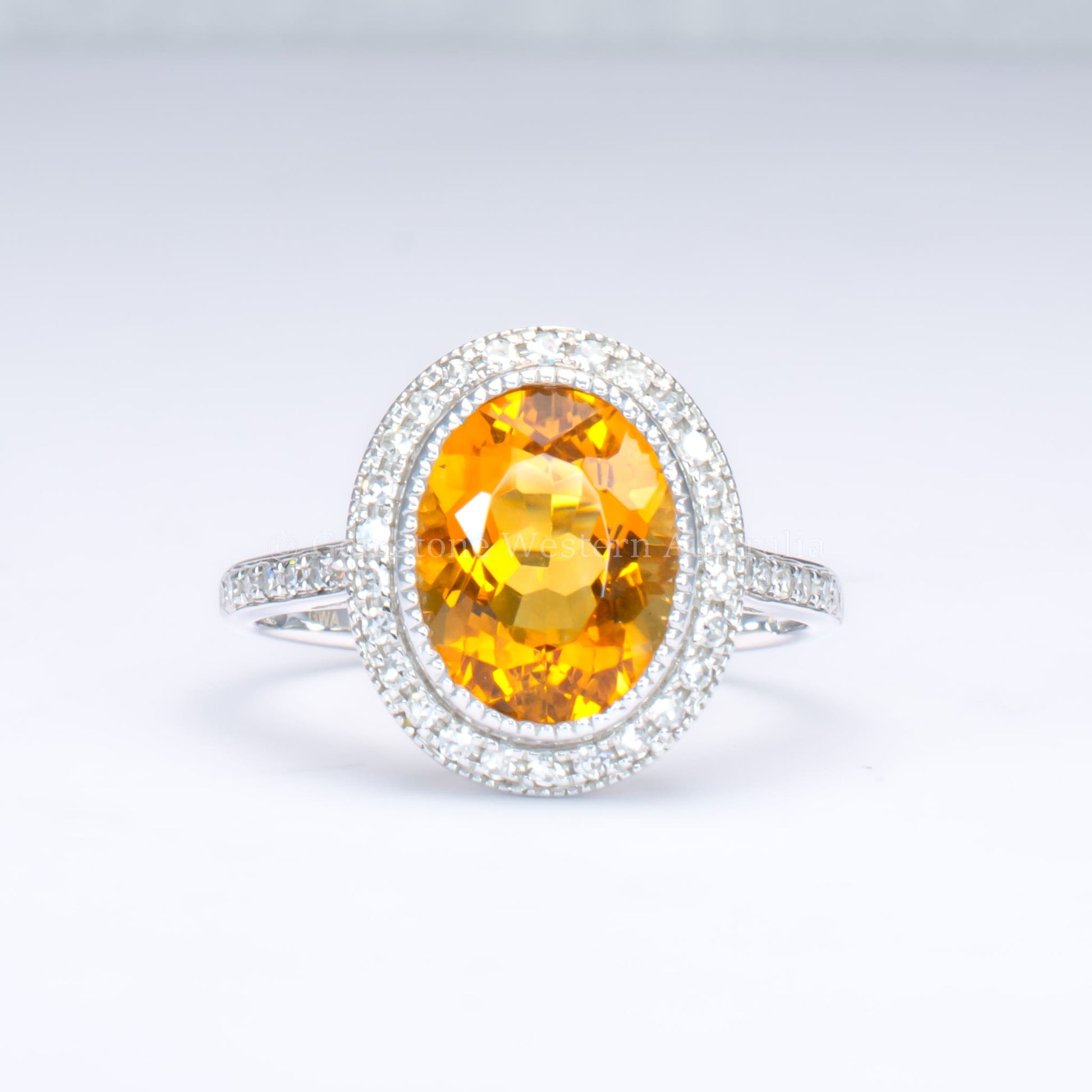Oval-Cut Citrine Ring with Diamond Halo in 18K White Gold
