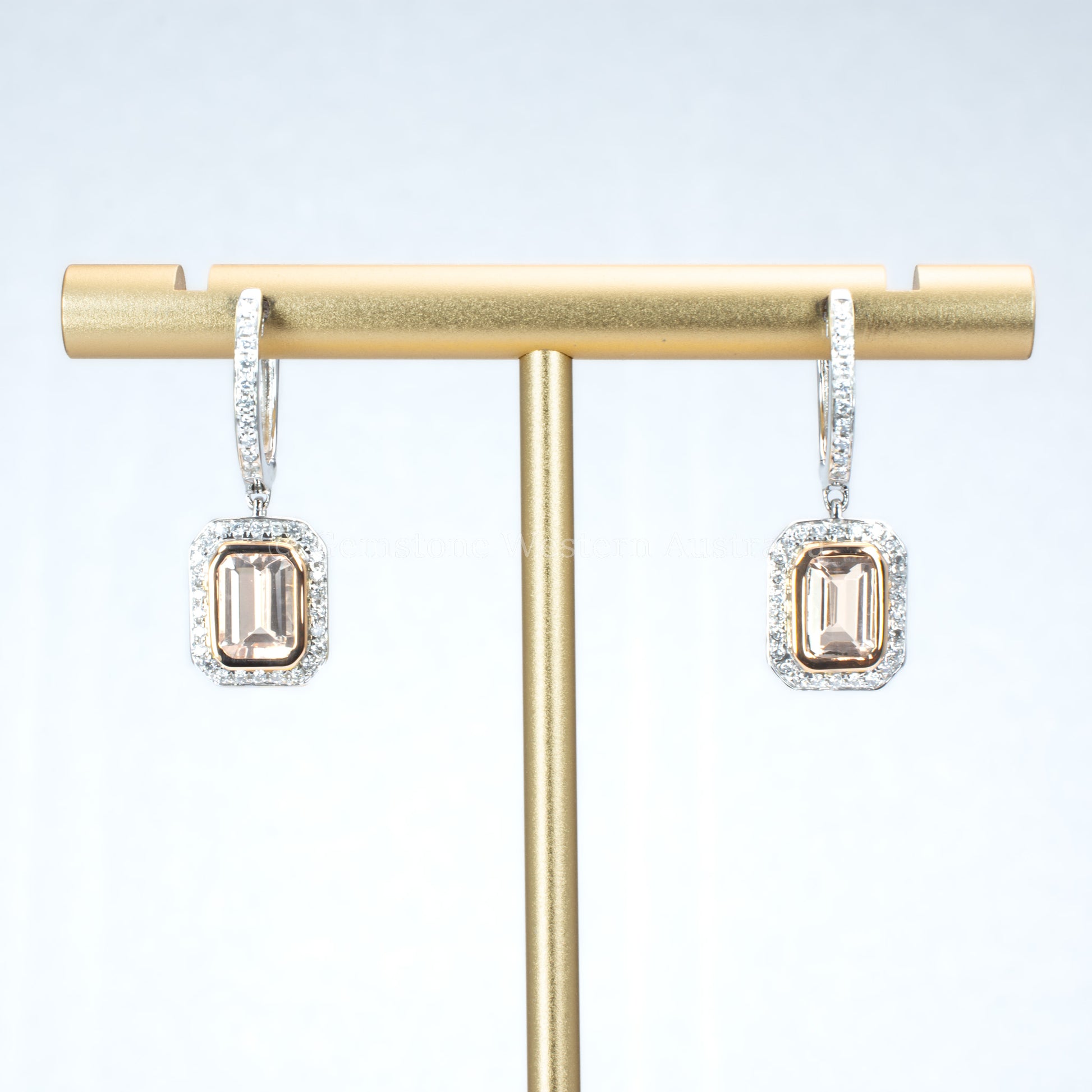 morganite and diamonds gold earrings in light gray background