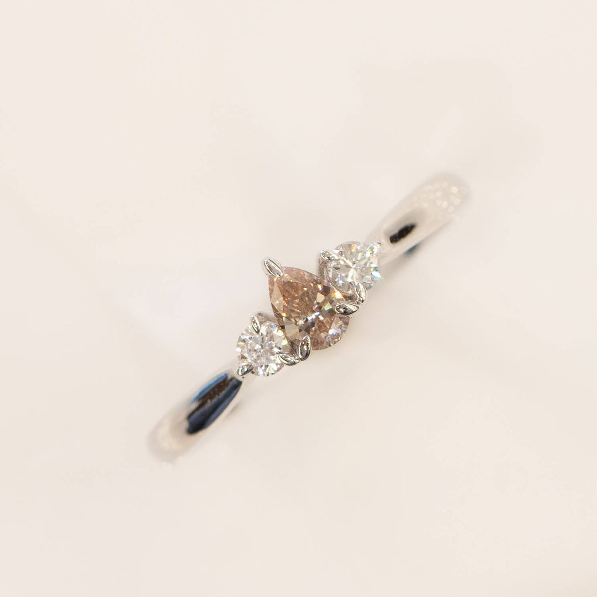 Pear shaped Argyle Pink Diamond Ring with Diamond Accents in 18K Gold