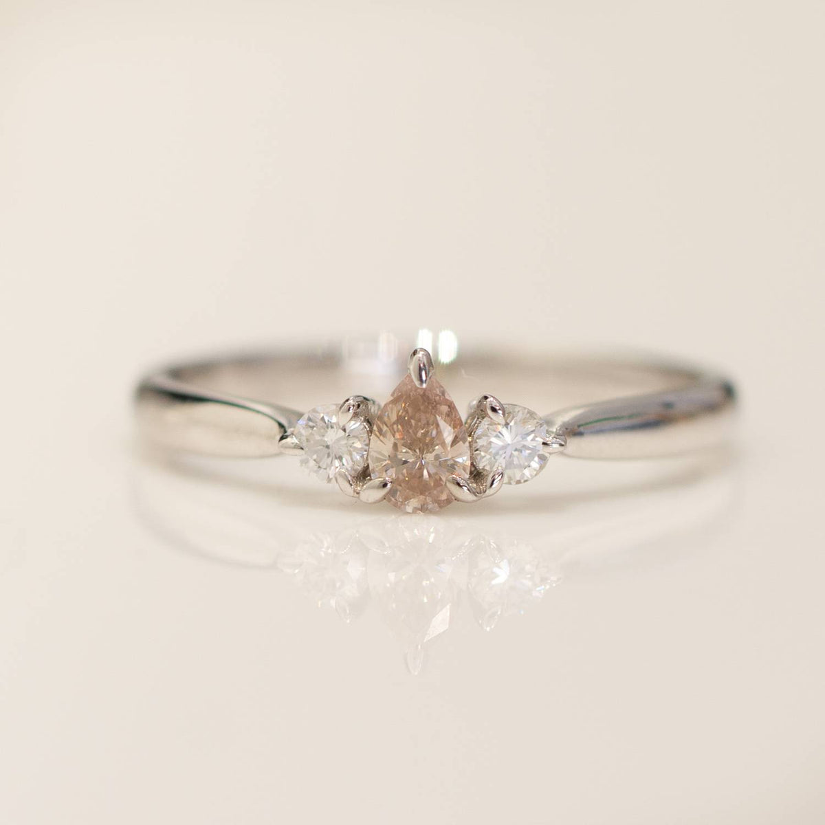 Pear shaped Argyle Pink Diamond Ring with Diamond Accents in 18K Gold