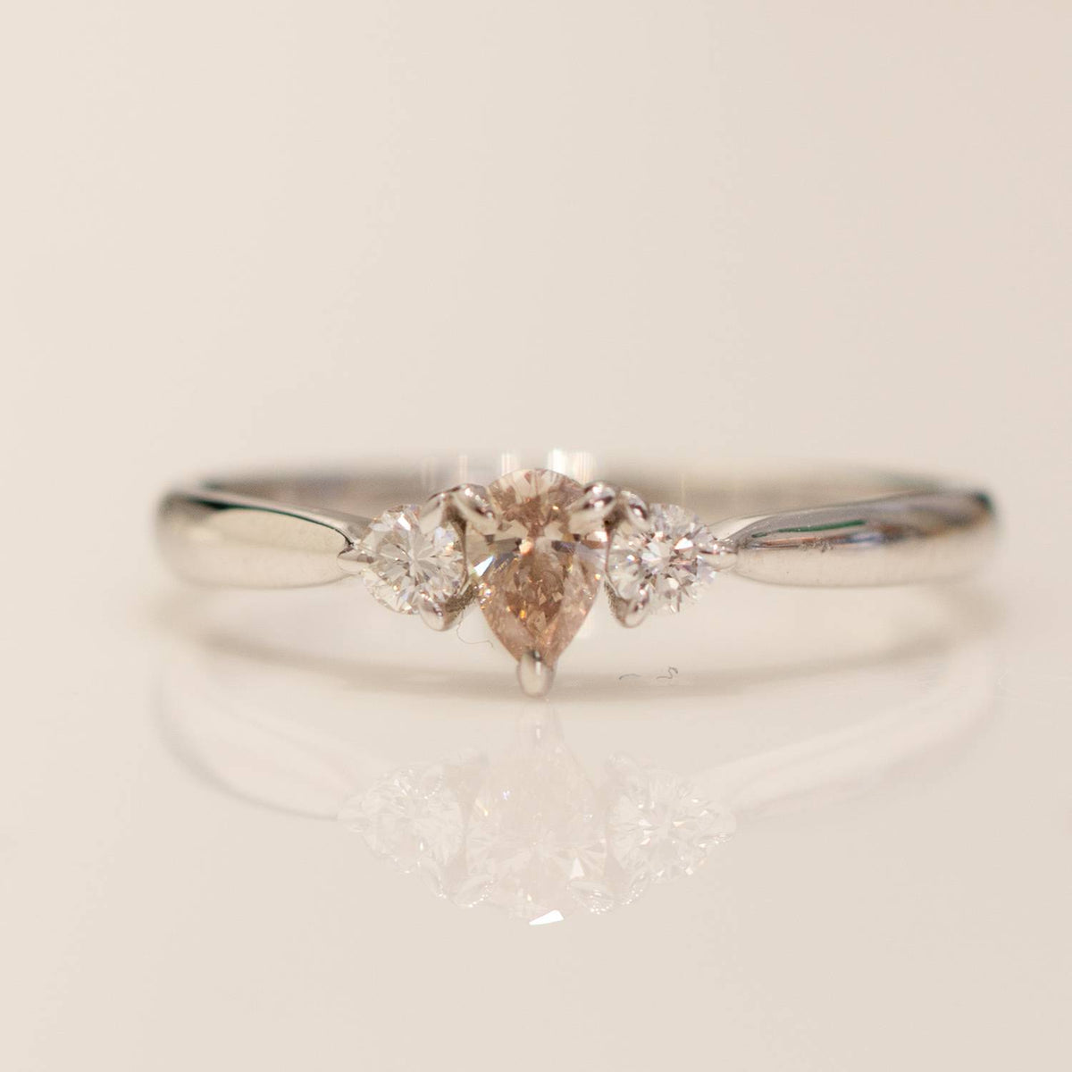 Pear shaped Argyle Pink Diamond Ring with Diamond Accents in 18K Gold