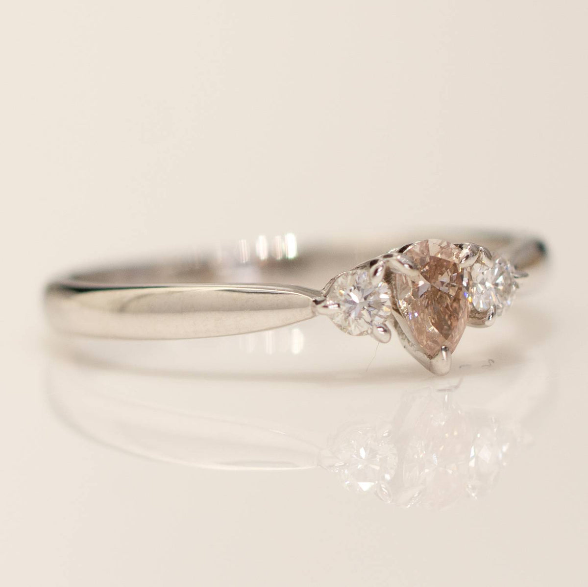 Pear shaped Argyle Pink Diamond Ring with Diamond Accents in 18K Gold