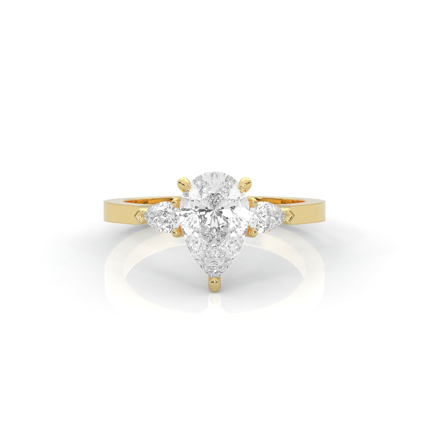 yellow gold ring with a pear-shaped diamond on a white background