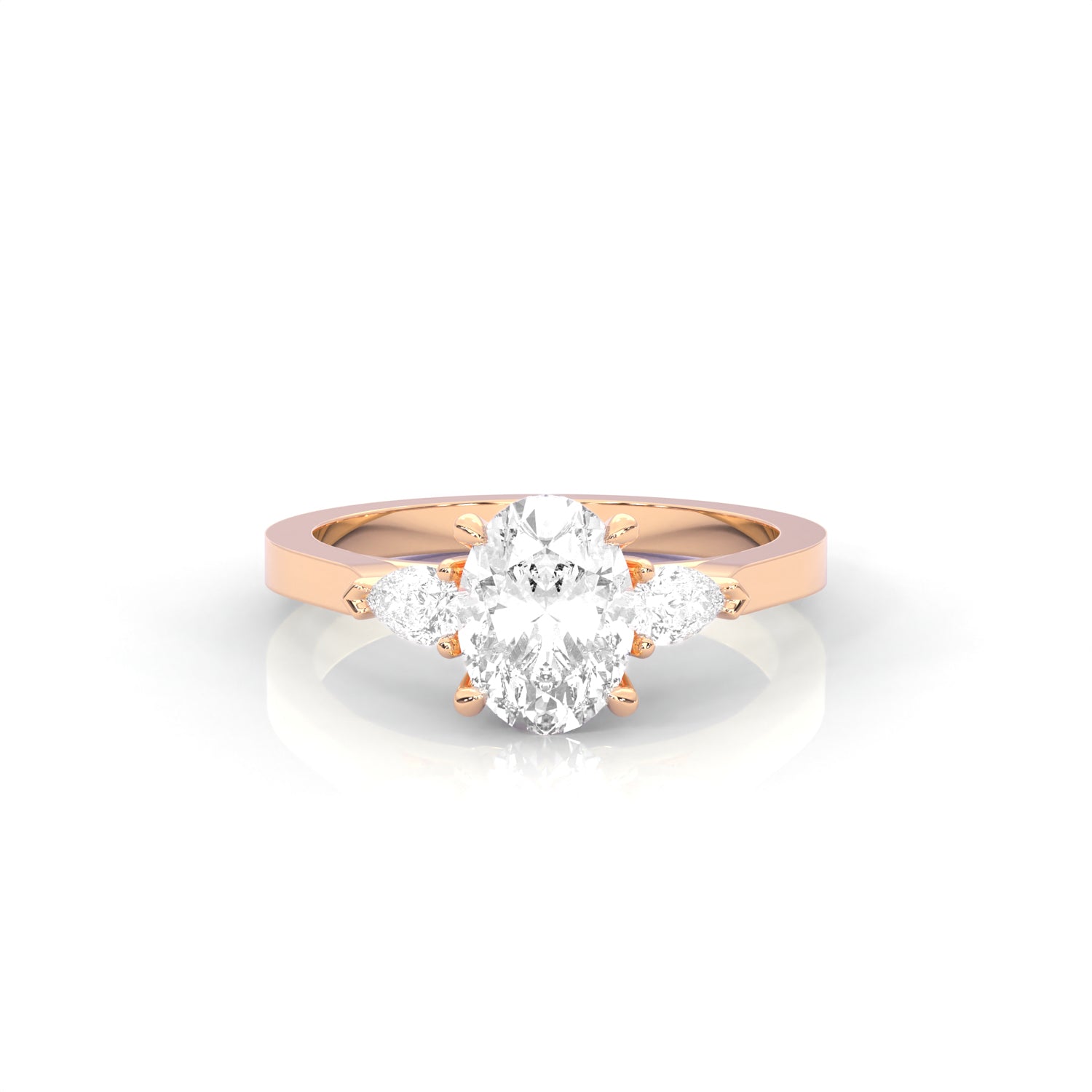 rose gold ring with two pear-shaped diamonds on a white background