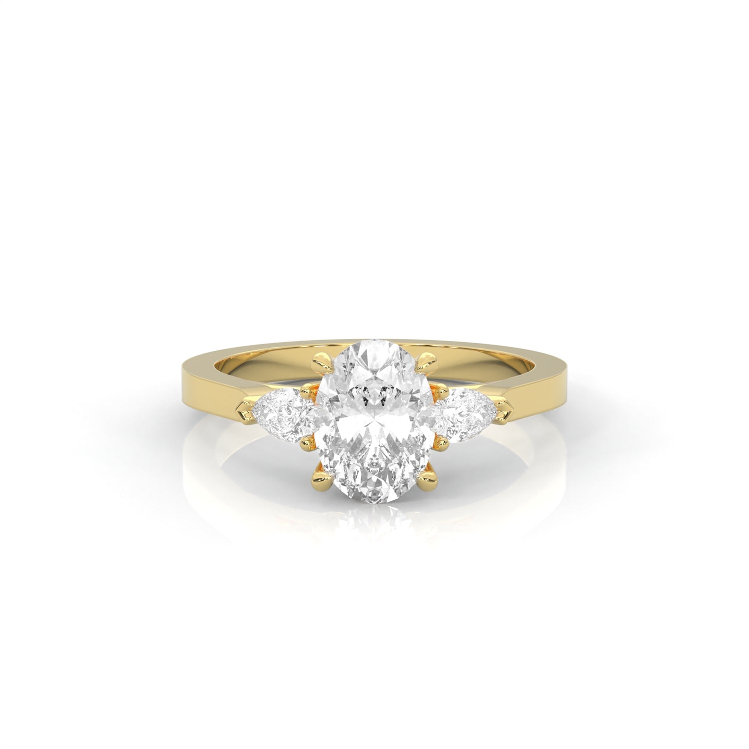Yellow gold oval shape Diamond three stone diamond ring on a white background