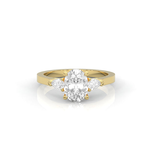 Gold ring with two pear-shaped diamonds on a white background
