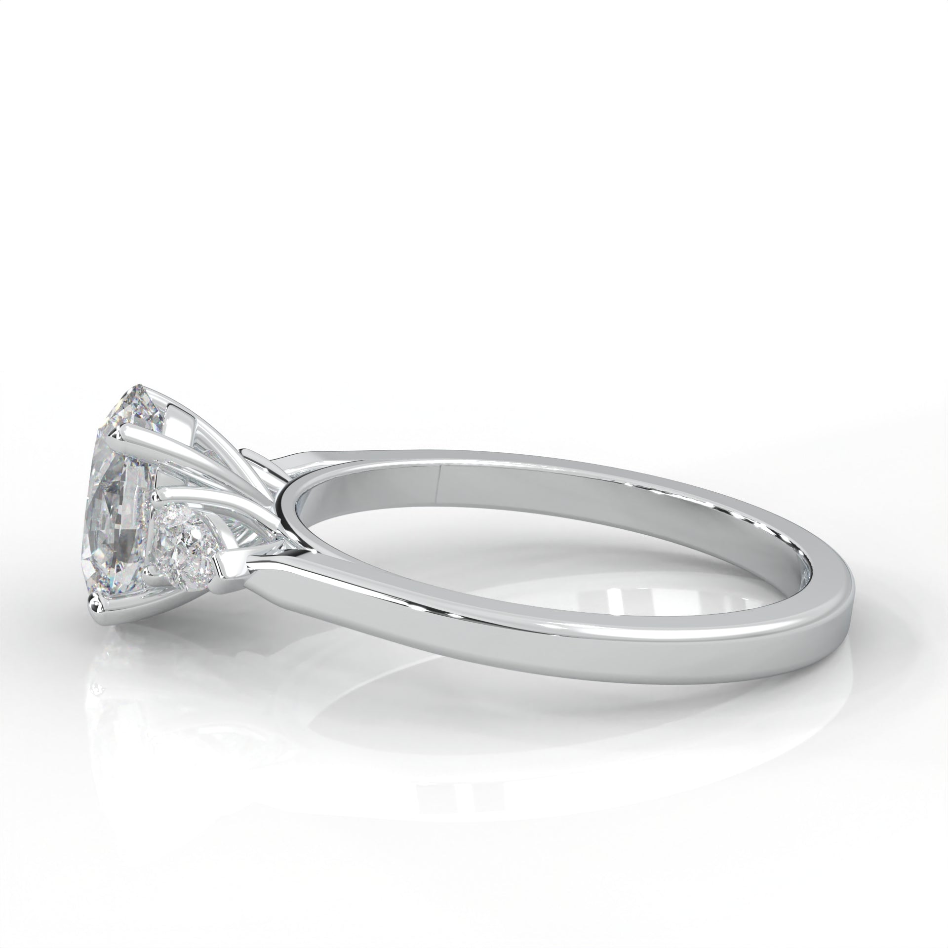 side view of Gold ring with two pear-shaped diamonds on a white background