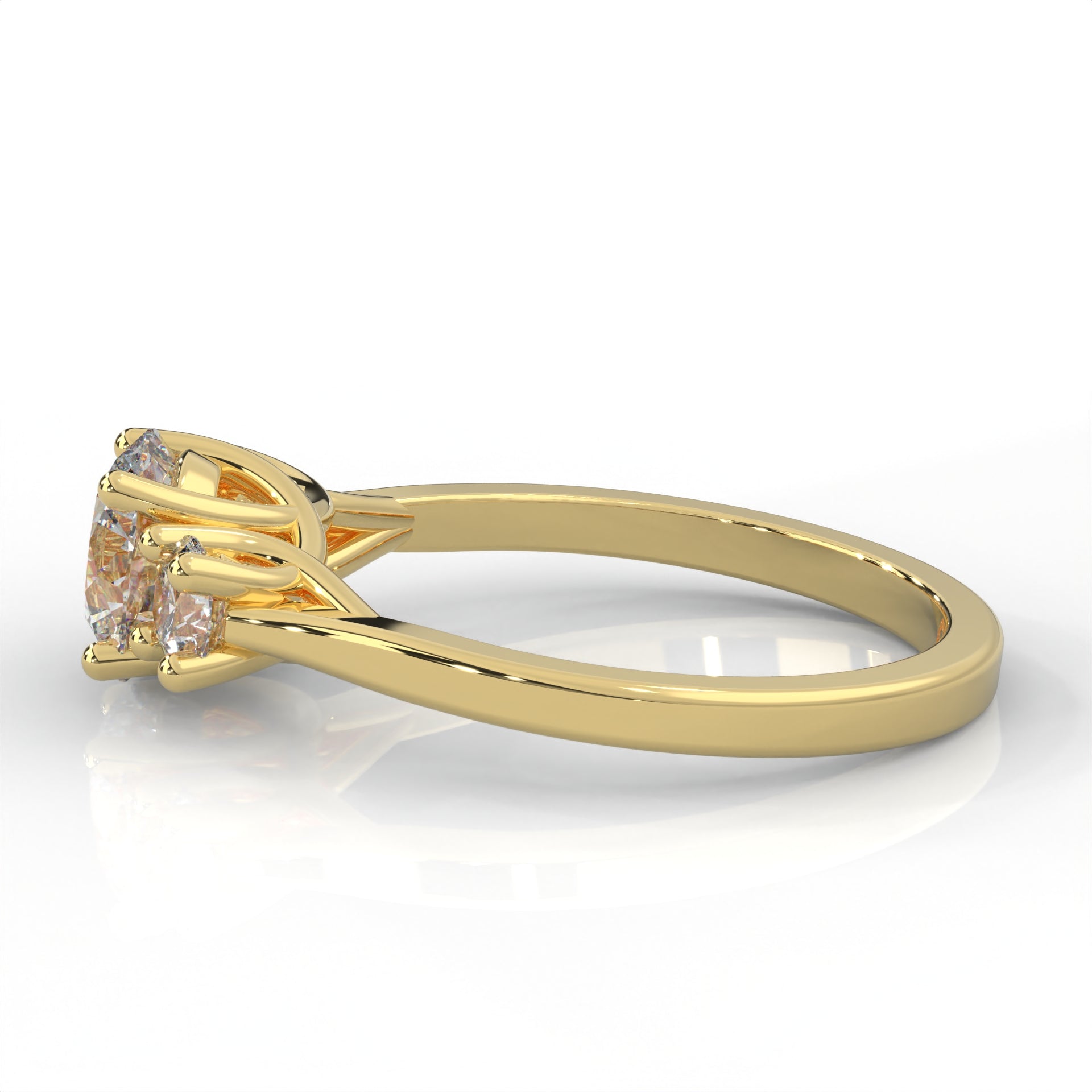 side view of yellow gold three stone ring with round side diamonds and round centre stone on white background