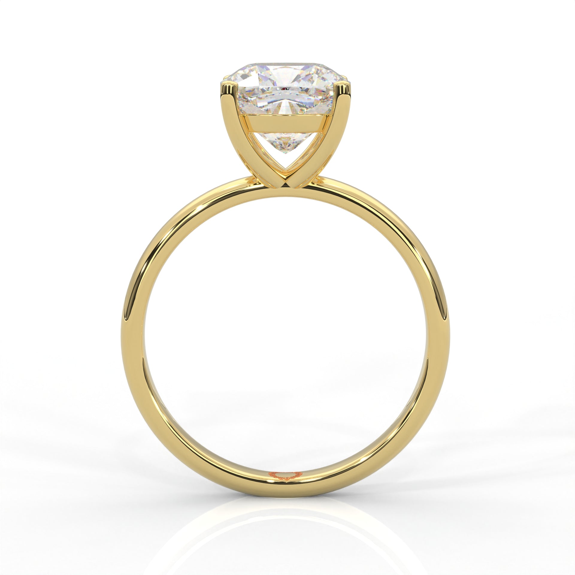 front view of Yellow gold solitaire ring with round diamond on a white background