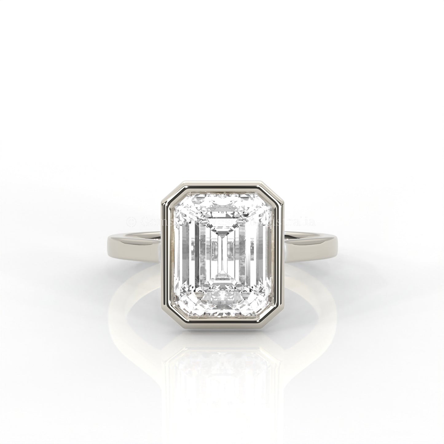 bezel set emerald-cut diamond ring in white gold