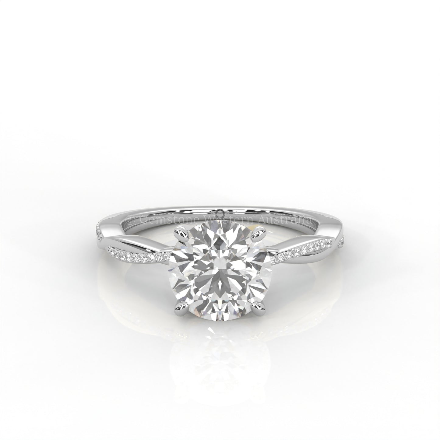 white Gold ring with a round diamond and smaller diamonds on the band against a white background