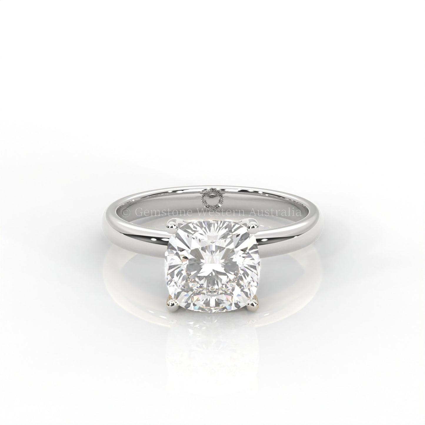 white gold cushion-cut solitaire diamond ring in white background