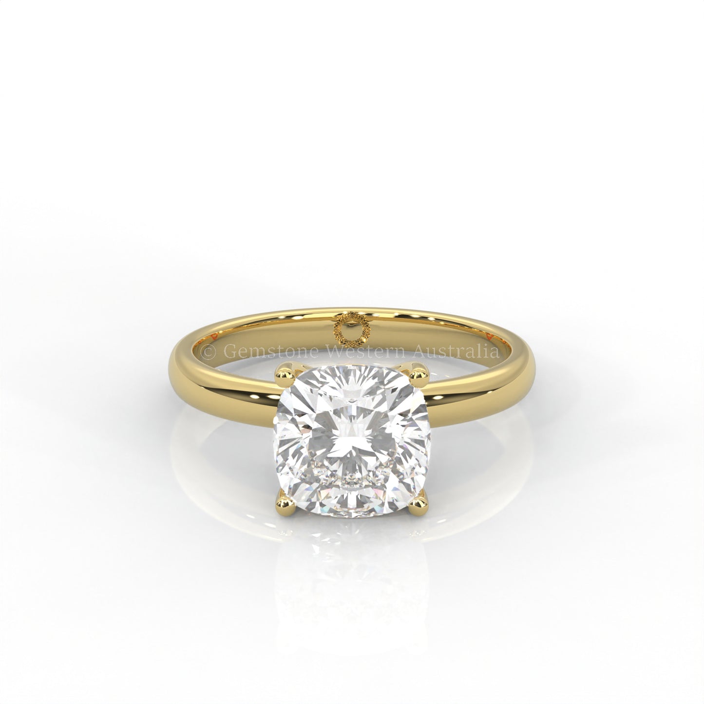 yellow gold cushion-cut solitaire diamond ring in white background
