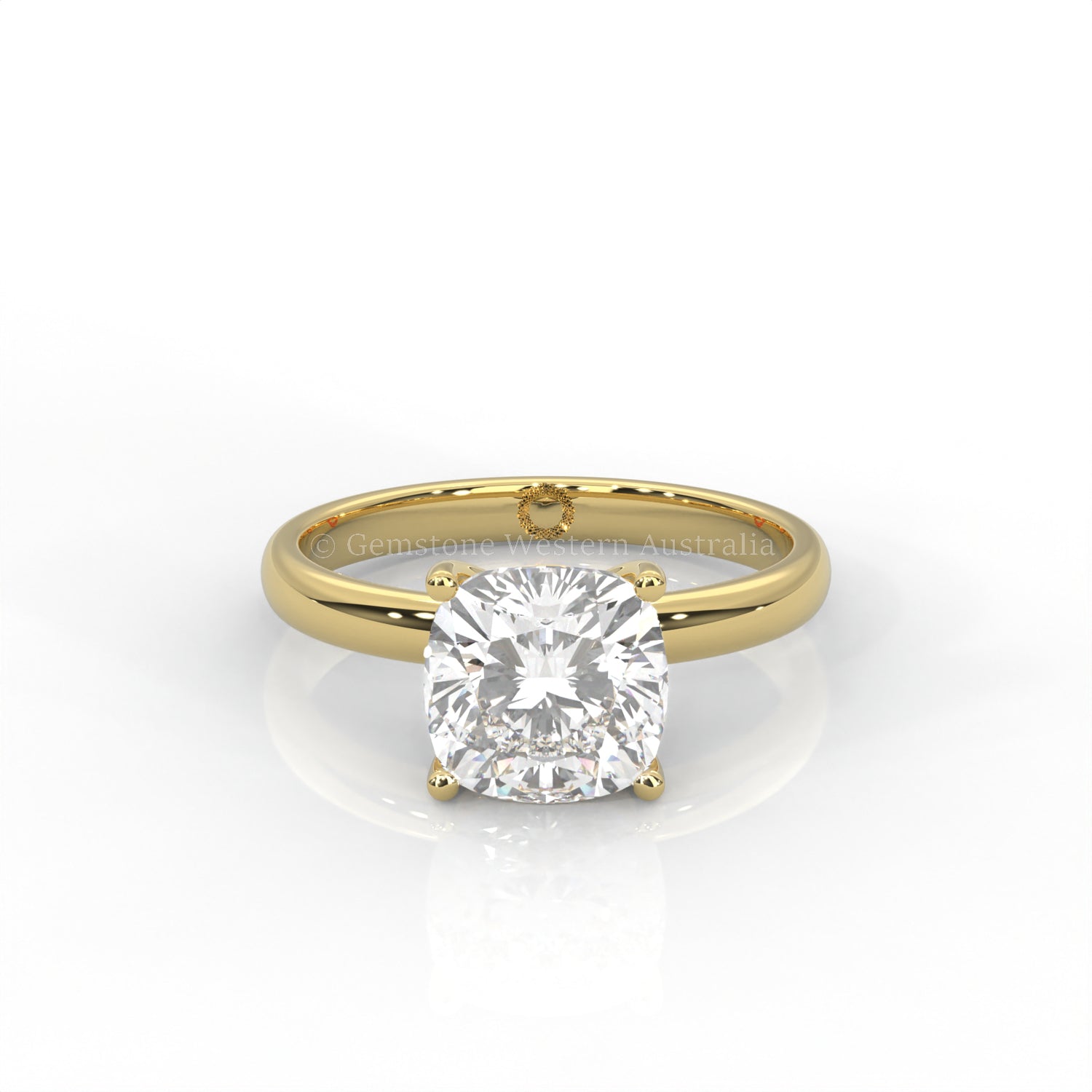 yellow gold cushion-cut solitaire diamond ring in white background