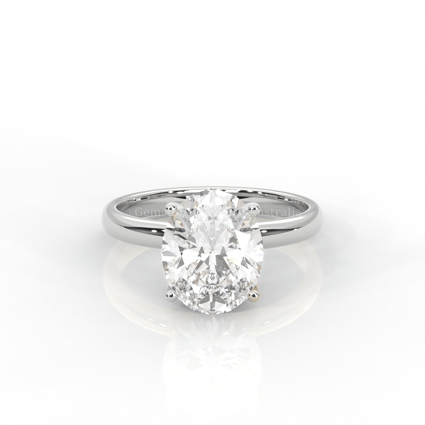 white gold solitaire ring with oval-cut diamond in a white background