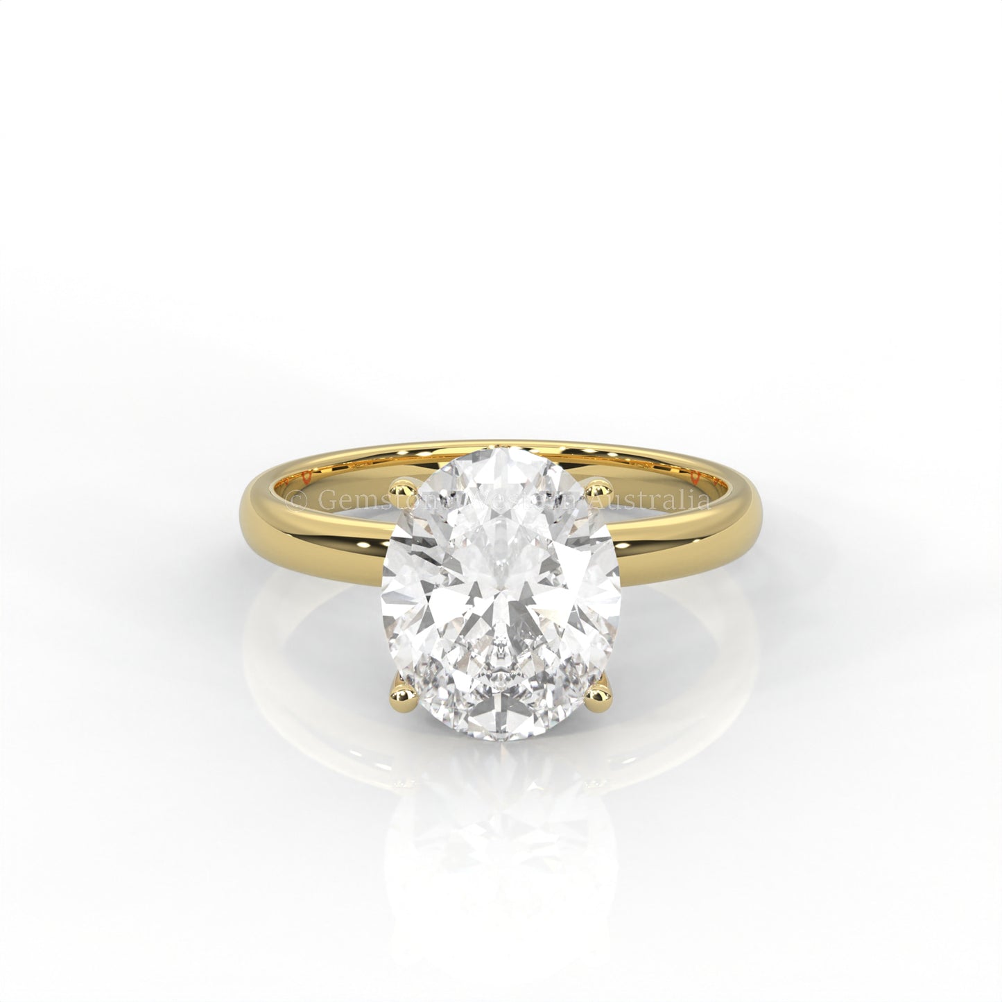 yellow gold solitaire ring with oval-cut diamond in a white background