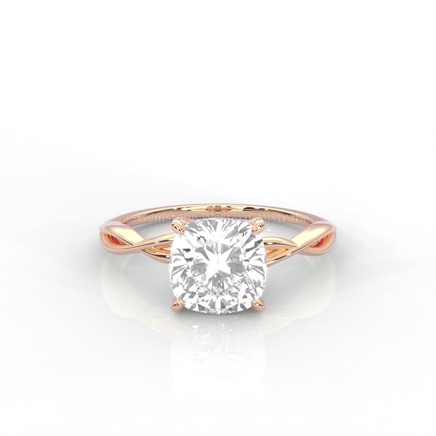 Rose gold ring with cushion cut diamond and twisted band 